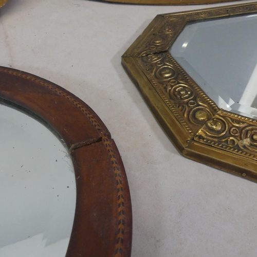 2489 - Five various wall mirrors, to include an octagonal repousse brass framed example.