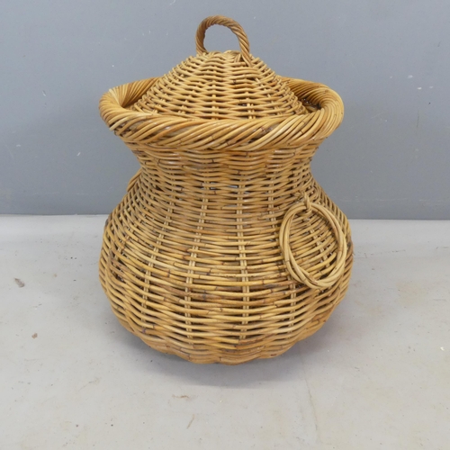 2494 - A wicker snake charmer's basket. Height 70cm.