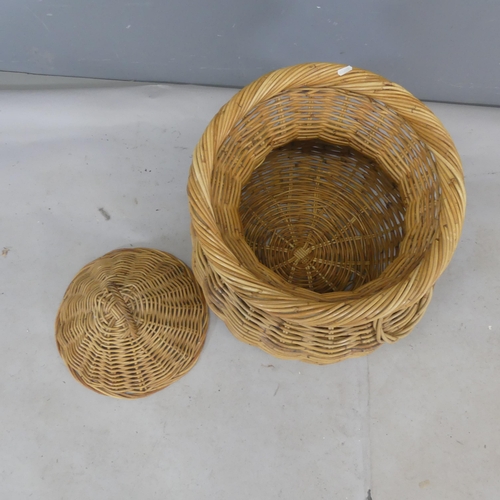 2494 - A wicker snake charmer's basket. Height 70cm.