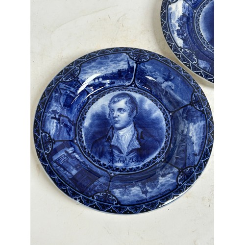 256 - A pair of Staffordshire portrait plaques, depicting Burns and Dickens, and a Japanese blue and white... 