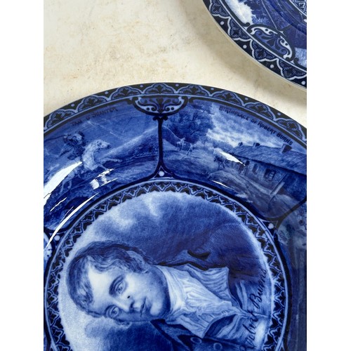 256 - A pair of Staffordshire portrait plaques, depicting Burns and Dickens, and a Japanese blue and white... 