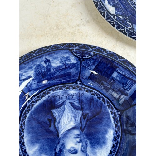 256 - A pair of Staffordshire portrait plaques, depicting Burns and Dickens, and a Japanese blue and white... 