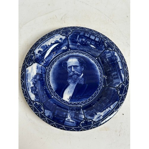 256 - A pair of Staffordshire portrait plaques, depicting Burns and Dickens, and a Japanese blue and white... 