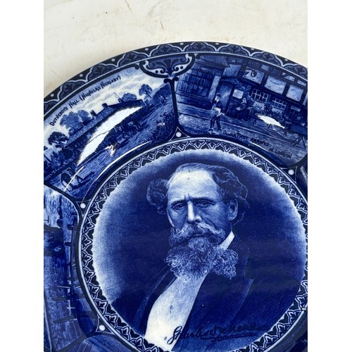 256 - A pair of Staffordshire portrait plaques, depicting Burns and Dickens, and a Japanese blue and white... 