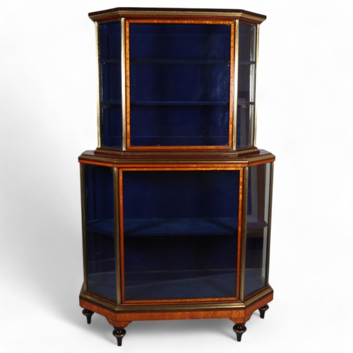 512 - A Victorian satinwood mahogany and brass-edge display cabinet, with canted corners and turned feet, ... 