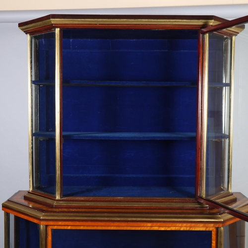 512 - A Victorian satinwood mahogany and brass-edge display cabinet, with canted corners and turned feet, ... 