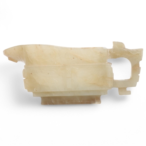 402 - A Chinese pale green/brown jade Archaistic style pouring vessel, length 12cm