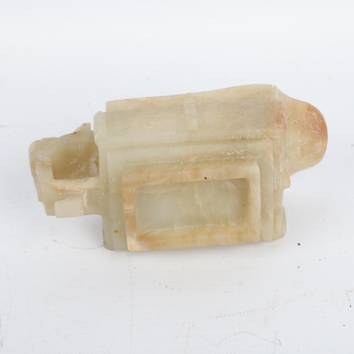 402 - A Chinese pale green/brown jade Archaistic style pouring vessel, length 12cm