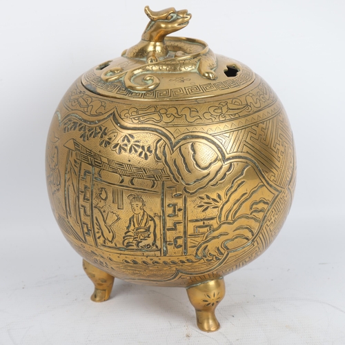 404 - A Chinese brass incense burner and cover, with engraved decoration and dragon mounted lid, height 19... 