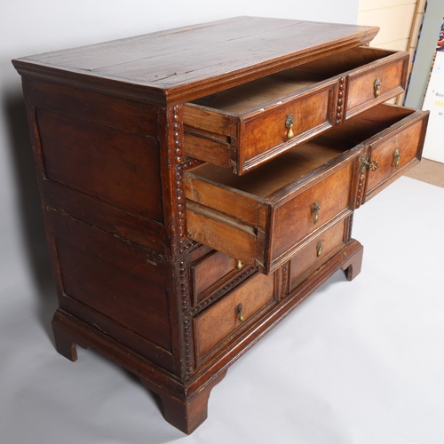 500 - An 18th century oak and walnut chest of drawers, in 2 parts, with moulded panelled drawer fronts and... 