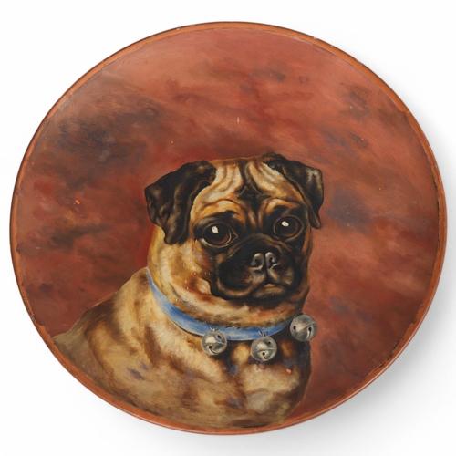 507 - J & Hutheson of Glasgow, an apprentice piece hand painted Pug dog painting on a terracotta plate, pa... 