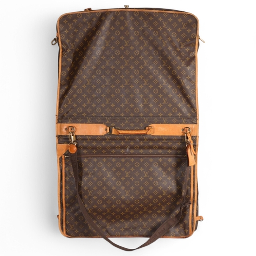 509 - LOUIS VUITTON - a Louis Vuitton Monogram suit carrying case, serial no. VX1920, width 60cm