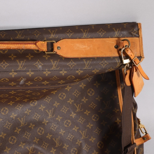 509 - LOUIS VUITTON - a Louis Vuitton Monogram suit carrying case, serial no. VX1920, width 60cm