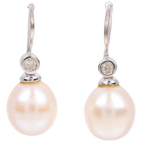 1169 - A pair of 18ct white gold whole pearl and diamond earrings, with shepherd hook fittings, 24mm, 3.9g