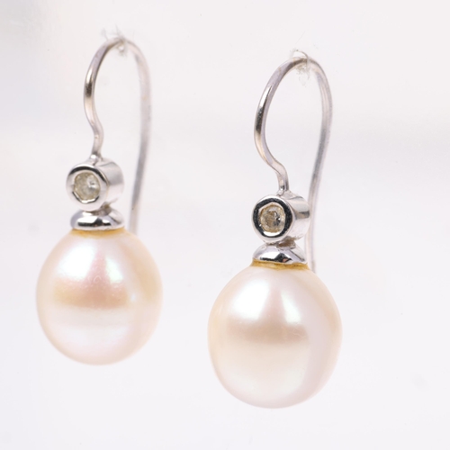 1169 - A pair of 18ct white gold whole pearl and diamond earrings, with shepherd hook fittings, 24mm, 3.9g