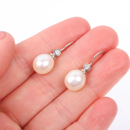 1169 - A pair of 18ct white gold whole pearl and diamond earrings, with shepherd hook fittings, 24mm, 3.9g