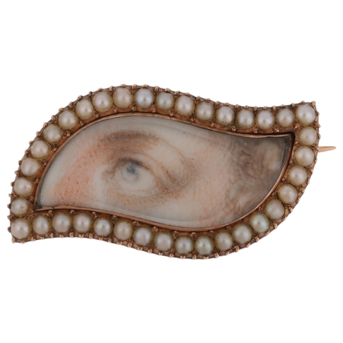 1100 - ROYAL INTEREST - an Antique Georgian split pearl 'Lover's Eye' brooch, circa 1820, shaped form with ... 