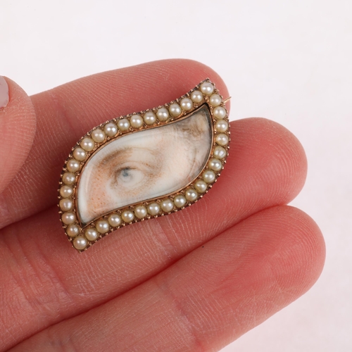 1100 - ROYAL INTEREST - an Antique Georgian split pearl 'Lover's Eye' brooch, circa 1820, shaped form with ... 