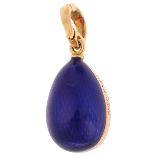 1104 - FABERGE - an 18ct gold blue enamel and diamond egg pendant, with engine turned blue guilloche enamel... 