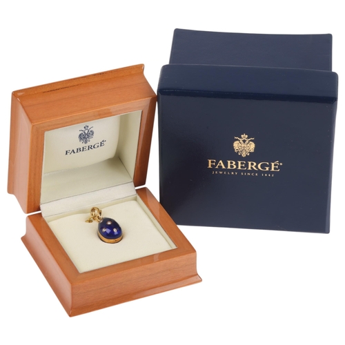 1104 - FABERGE - an 18ct gold blue enamel and diamond egg pendant, with engine turned blue guilloche enamel... 