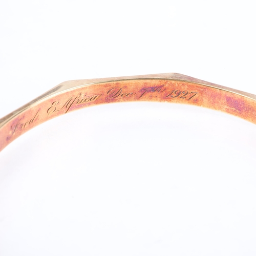 1108 - A large Art Deco 15ct gold bangle, T & H Crathorne Ltd, Birmingham 1927, faceted form with engine tu... 