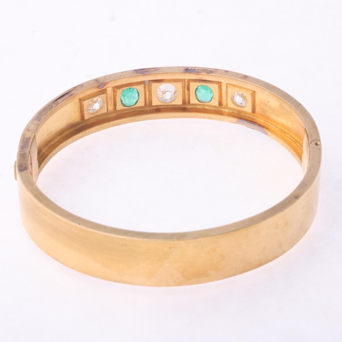 1128 - An Antique Victorian 18ct gold five stone emerald and diamond hinged bangle, circa 1860, square set ... 