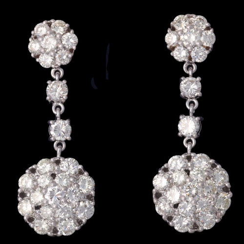 1129 - A pair of 18ct white gold diamond cluster drop stud earrings, each set with 2 graduated modern round... 