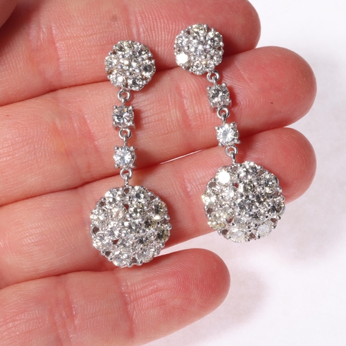 1129 - A pair of 18ct white gold diamond cluster drop stud earrings, each set with 2 graduated modern round... 