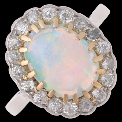 1131 - An Antique platinum opal and diamond cluster ring, re-hallmarked for London 2016, claw set with 0.65... 