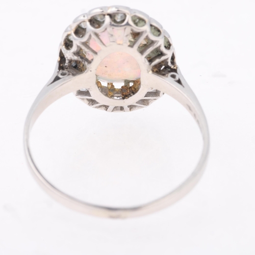 1131 - An Antique platinum opal and diamond cluster ring, re-hallmarked for London 2016, claw set with 0.65... 