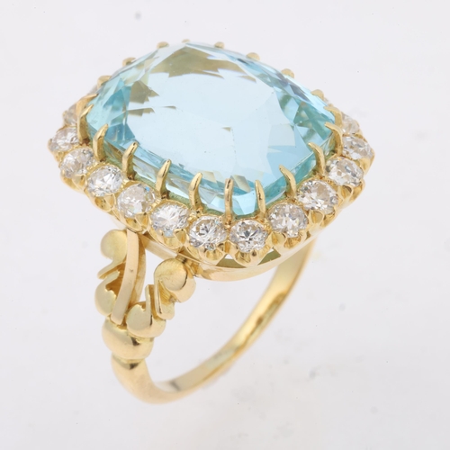 1148 - An 18ct gold aquamarine and diamond cluster ring, set with 10ct cushion-cut aquamarine surrounded by... 