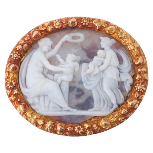 1149 - An Antique hardstone cameo brooch, the oval panel relief carved depicting female figures with cherub... 