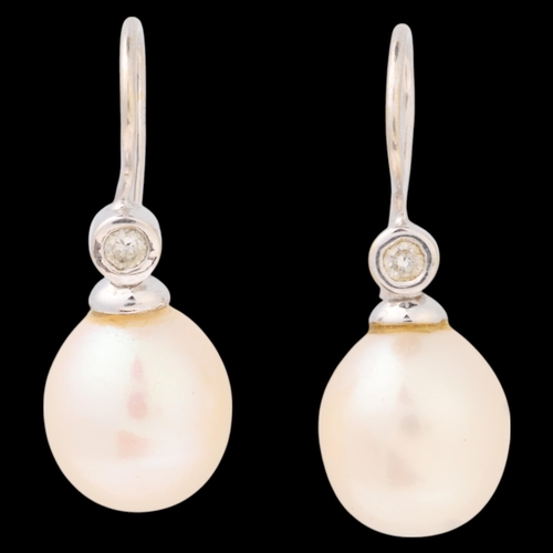 1169 - A pair of 18ct white gold whole pearl and diamond earrings, with shepherd hook fittings, 24mm, 3.9g