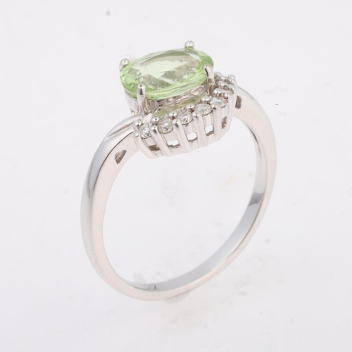 1179 - An 18ct white gold Paraiba tourmaline and diamond ring, maker DK, Birmingham 2008, claw set with 0.8... 