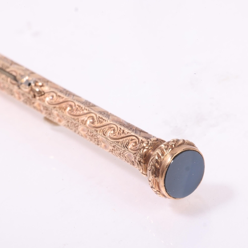 1191 - An Antique 9ct gold combination propelling pencil/dip pen, allover engraved decoration with seal top... 