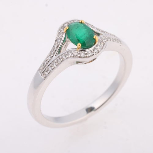 1192 - An 18ct white gold emerald and diamond ring, maker LA, Birmingham 2007, claw set with oval mixed-cut... 