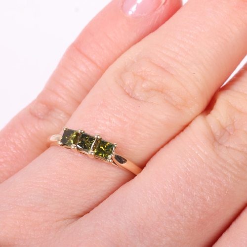 1215 - A 9ct gold three stone green diamond ring, Birmingham 2019, claw set with Princess-cut diamonds, tot... 