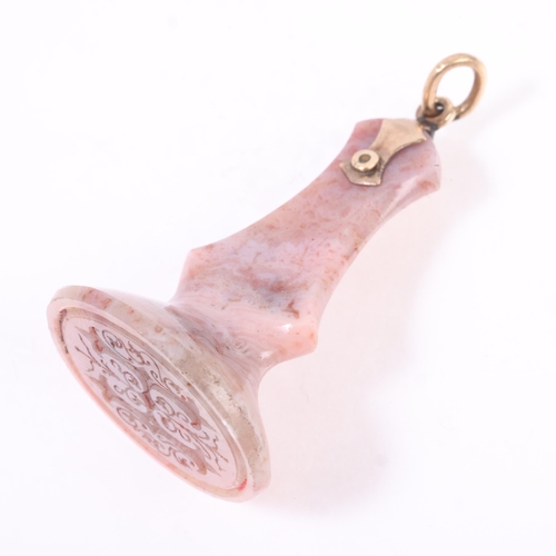 1225 - An Antique Continental pink lace agate seal fob, 18th century, the oval panel intaglio carved with G... 