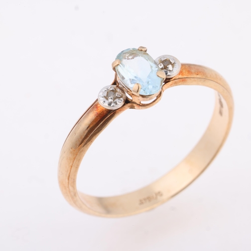 1268 - A 9ct gold three stone blue topaz and diamond ring, claw set with oval mixed-cut topaz and single-cu... 