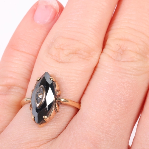 1270 - A 9ct gold hematite and cubic zirconia ring, set with faceted marquise hematite, setting height 15.9... 