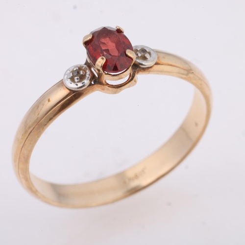 1271 - A 9ct gold three stone garnet and diamond ring, claw set with oval mixed-cut garnet and single-cut d... 