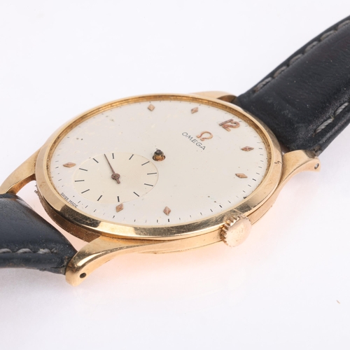 1004 - OMEGA - a Vintage 18ct gold mechanical wristwatch, circa 1950, white dial with gilt lozenge hour mar... 