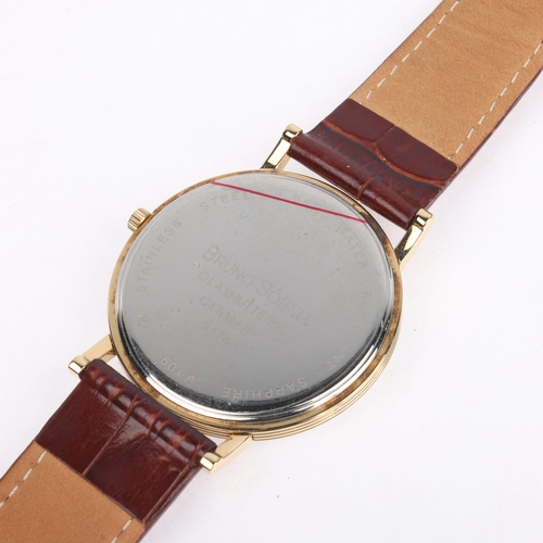 1026 - BRUNO SOHNLE - a gold plated stainless steel Sonate quartz calendar wristwatch, ref. 17-23109-920, w... 