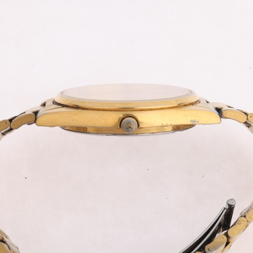 1038 - SEIKO - a gold plated stainless steel quartz calendar bracelet watch, ref. 7N43-7A50, champagne dial... 