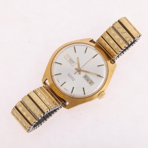 1050 - TISSOT - a Vintage gold plated stainless steel Seastar automatic calendar bracelet watch, ref. 46598... 