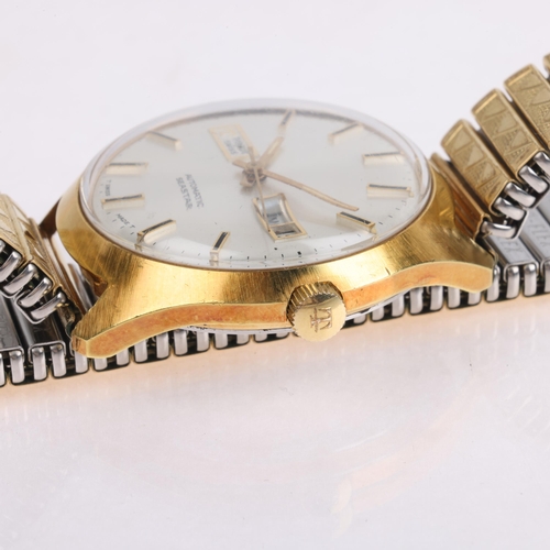 1050 - TISSOT - a Vintage gold plated stainless steel Seastar automatic calendar bracelet watch, ref. 46598... 