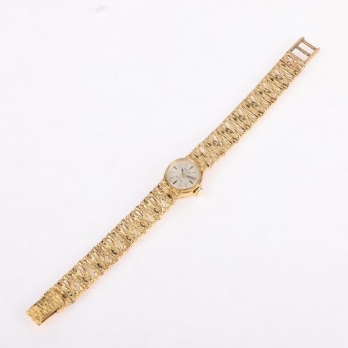 1058 - ROTARY - a lady's Vintage 9ct gold mechanical bracelet watch, circa 1970s, silvered dial with gilt b... 