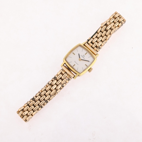 1062 - OMEGA - a lady's Vintage gold plated stainless steel Geneve mechanical bracelet watch, ref. 511.298,... 