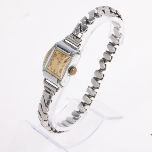 1063 - HERMES - a lady's Vintage chrome plated mechanical bracelet watch, circa 1960s, silvered dial with g... 