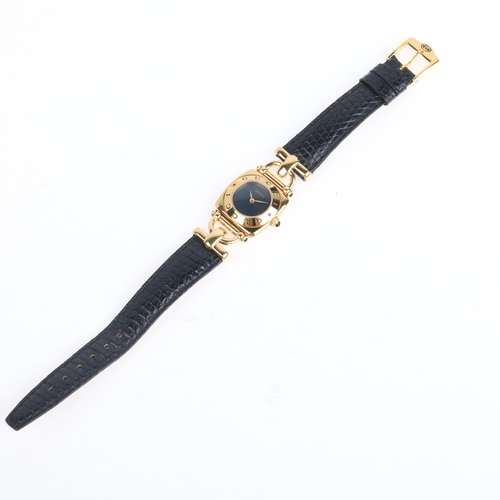 1065 - GUCCI - a lady's gold plated 6300L quartz wristwatch, blue dial with gilt leaf hands and Gucci bezel... 